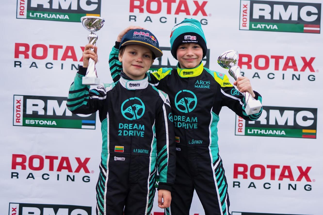 Dream 2 Drive karting drivers on the Rotax podium with trophies
